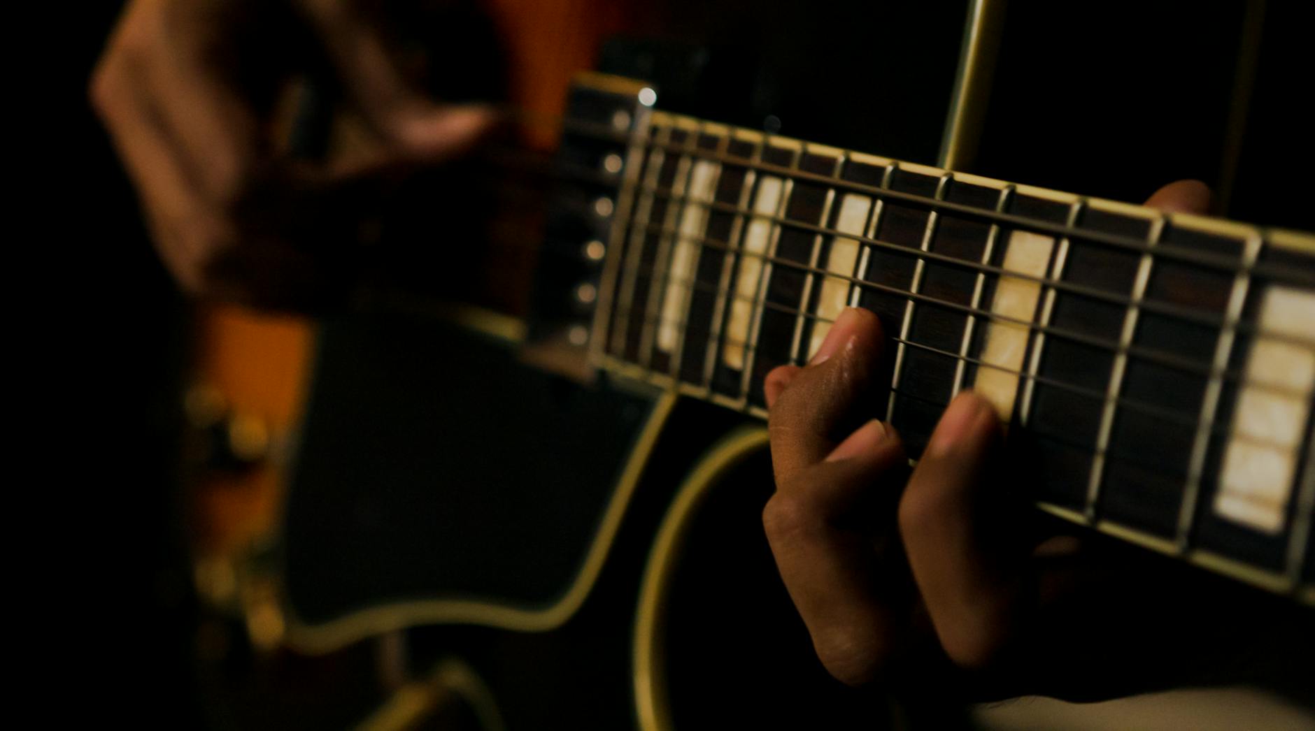 a person playing the guitar