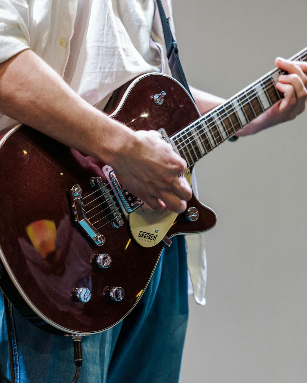 close up of guitarist playing electric guitar